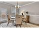 Dining area with stylish furniture, a decorative rug and natural light at 539 Walton Dr, Woodstock, GA 30188