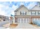 Charming townhome featuring a two-car garage and well-maintained landscaping in a desirable community at 539 Walton Dr, Woodstock, GA 30188