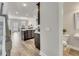 Open-concept kitchen with dark cabinets, granite countertops, and modern appliances at 539 Walton Dr, Woodstock, GA 30188