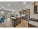 Modern kitchen with granite countertops, stainless steel appliances, and hardwood floors at 539 Walton Dr, Woodstock, GA 30188
