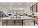 Open kitchen featuring a large island with granite countertops and stainless steel appliances at 539 Walton Dr, Woodstock, GA 30188