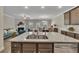 Kitchen island with granite countertop and stainless steel dishwasher at 539 Walton Dr, Woodstock, GA 30188