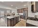 Modern kitchen with stainless steel appliances, granite countertops and an island with a sink at 539 Walton Dr, Woodstock, GA 30188