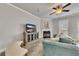 Bright living room featuring a comfortable couch, fireplace, and a TV console at 539 Walton Dr, Woodstock, GA 30188