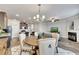 Open-concept space featuring a dining area, kitchen and living room with fireplace at 539 Walton Dr, Woodstock, GA 30188