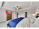 Bright main bedroom featuring tray ceiling, fan, plush carpet and dresser at 539 Walton Dr, Woodstock, GA 30188