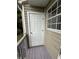 Exterior view of the back door, siding and window at 5768 Windgate Ln, Lithonia, GA 30058