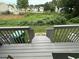 View of the overgrown backyard from the back steps at 5768 Windgate Ln, Lithonia, GA 30058