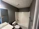 Bathroom with a white tub and shower combination and gray walls at 5768 Windgate Ln, Lithonia, GA 30058