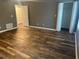 Bedroom featuring wood flooring, closet, and neutral paint, creating a serene and inviting atmosphere at 5768 Windgate Ln, Lithonia, GA 30058