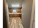 Modern kitchen featuring stainless steel appliances and hardwood flooring at 5768 Windgate Ln, Lithonia, GA 30058