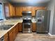 Well-equipped kitchen features stainless steel appliances and ample cabinet space at 5768 Windgate Ln, Lithonia, GA 30058