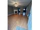 Bright living room featuring fireplace, ceiling fan and hardwood floors at 5768 Windgate Ln, Lithonia, GA 30058