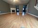 Bright living room featuring fireplace, ceiling fan and hardwood floors at 5768 Windgate Ln, Lithonia, GA 30058