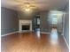 Spacious living room boasts a fireplace and hardwood floors at 5768 Windgate Ln, Lithonia, GA 30058
