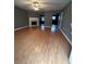 Bright living room featuring fireplace, ceiling fan and hardwood floors at 5768 Windgate Ln, Lithonia, GA 30058