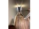 View from the top of a staircase with wood treads and a white and wood railing at 5768 Windgate Ln, Lithonia, GA 30058