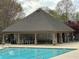 Community pool features covered pavilion with ample seating and amenities for relaxation at 2304 Northglenn Ct, Conyers, GA 30013