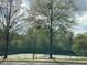 Community tennis courts for residents to enjoy a friendly match or practice their skills at 2304 Northglenn Ct, Conyers, GA 30013