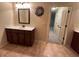 This bathroom offers a vanity with a mirror and ample storage space at 2304 Northglenn Ct, Conyers, GA 30013