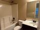 Bathroom with neutral walls, vanity, mirror, and tub shower combo at 2304 Northglenn Ct, Conyers, GA 30013