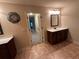 This bathroom offers a vanity with a mirror and ample storage space at 2304 Northglenn Ct, Conyers, GA 30013