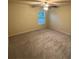 Bedroom with neutral carpet, a ceiling fan, and a window with blinds at 2304 Northglenn Ct, Conyers, GA 30013