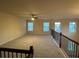 This bonus room provides a spacious area with abundant natural light and plush carpeting at 2304 Northglenn Ct, Conyers, GA 30013