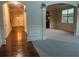 Open-concept foyer with hardwood and carpeted flooring, archways, and elegant trim at 2304 Northglenn Ct, Conyers, GA 30013