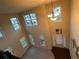 Two-story foyer showcases natural light, chandelier, and a welcoming entryway at 2304 Northglenn Ct, Conyers, GA 30013