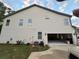 Side view of the house with an attached, two-car garage and vinyl siding at 2304 Northglenn Ct, Conyers, GA 30013