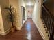 Elegant hallway with hardwood floors and decorative archways at 2304 Northglenn Ct, Conyers, GA 30013