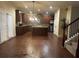 Spacious kitchen features wood cabinets, stainless steel appliances, and a central island with a granite countertop at 2304 Northglenn Ct, Conyers, GA 30013