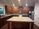 This expansive kitchen features a large island, stainless steel appliances, and beautiful wood cabinetry at 2304 Northglenn Ct, Conyers, GA 30013
