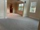 Living room with wainscoting, carpeted floor, and natural light at 2304 Northglenn Ct, Conyers, GA 30013