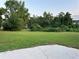 Spacious backyard featuring lush greenery and ample space for outdoor activities at 3305 Wolverton Sw Ct, Conyers, GA 30094