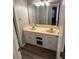 Bathroom vanity featuring double sinks and ample cabinet storage below at 3305 Wolverton Sw Ct, Conyers, GA 30094