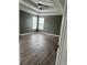 This bedroom offers sleek floors, neutral walls, trim and a ceiling fan at 3305 Wolverton Sw Ct, Conyers, GA 30094
