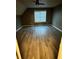 Spacious bedroom with gray wood flooring, ceiling fan and a large window at 3305 Wolverton Sw Ct, Conyers, GA 30094