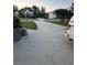 Wide view of long concrete driveway leading to street at 3305 Wolverton Sw Ct, Conyers, GA 30094