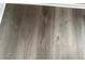 Close-up of modern gray wood flooring, showcasing its texture and finish at 3305 Wolverton Sw Ct, Conyers, GA 30094