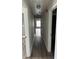Hallway with sleek floors, neutral wall paint and trim with natural light at 3305 Wolverton Sw Ct, Conyers, GA 30094