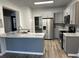 Modern kitchen with gray cabinets, stainless steel appliances, and bright countertop at 3305 Wolverton Sw Ct, Conyers, GA 30094