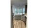 Stylish kitchen features gray cabinetry, marbled countertops, stainless sink, and a bay window at 3305 Wolverton Sw Ct, Conyers, GA 30094