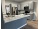 Stylish kitchen featuring gray cabinets, stainless steel appliances and bright countertop at 3305 Wolverton Sw Ct, Conyers, GA 30094