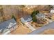 Aerial view of a traditional home with mature trees in a well-maintained neighborhood at 1657 Stilesboro Ridge Dr, Kennesaw, GA 30152
