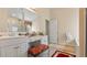 Bathroom vanity features dual sinks, seating area, and a large mirror at 1657 Stilesboro Ridge Dr, Kennesaw, GA 30152