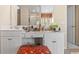 Bathroom vanity features dual sinks, seating area, and a large mirror at 1657 Stilesboro Ridge Dr, Kennesaw, GA 30152