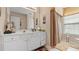 Bright bathroom features a dual sink vanity, large mirror, and ample storage space at 1657 Stilesboro Ridge Dr, Kennesaw, GA 30152