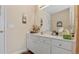 Bathroom vanity with white countertop and cabinets, ample storage, and a mirror at 1657 Stilesboro Ridge Dr, Kennesaw, GA 30152